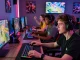 Engaged gamers enjoying PAKDE4D in a vibrant and immersive gaming environment.