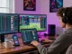 Engaged user participating in online gambling on newbet4d with multiple screens displaying live sports.